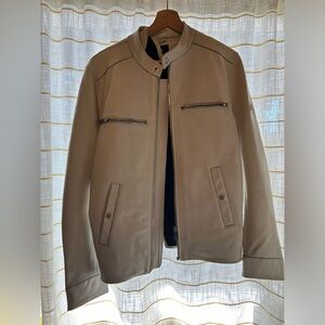 Twist on leather from Diesel with a white collarless leather jacket.